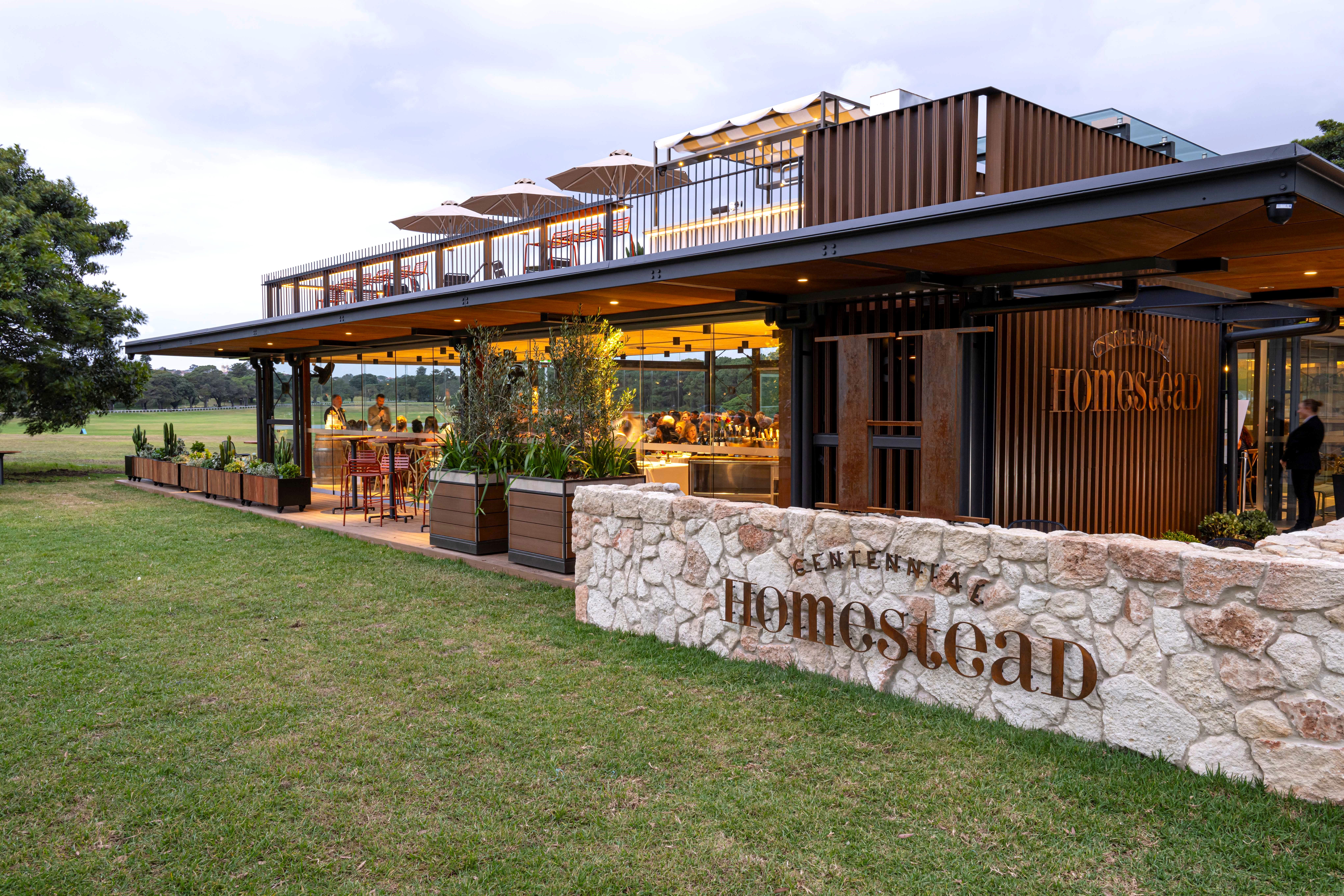 The Paddock with lawn and Treehouse rooftop bar